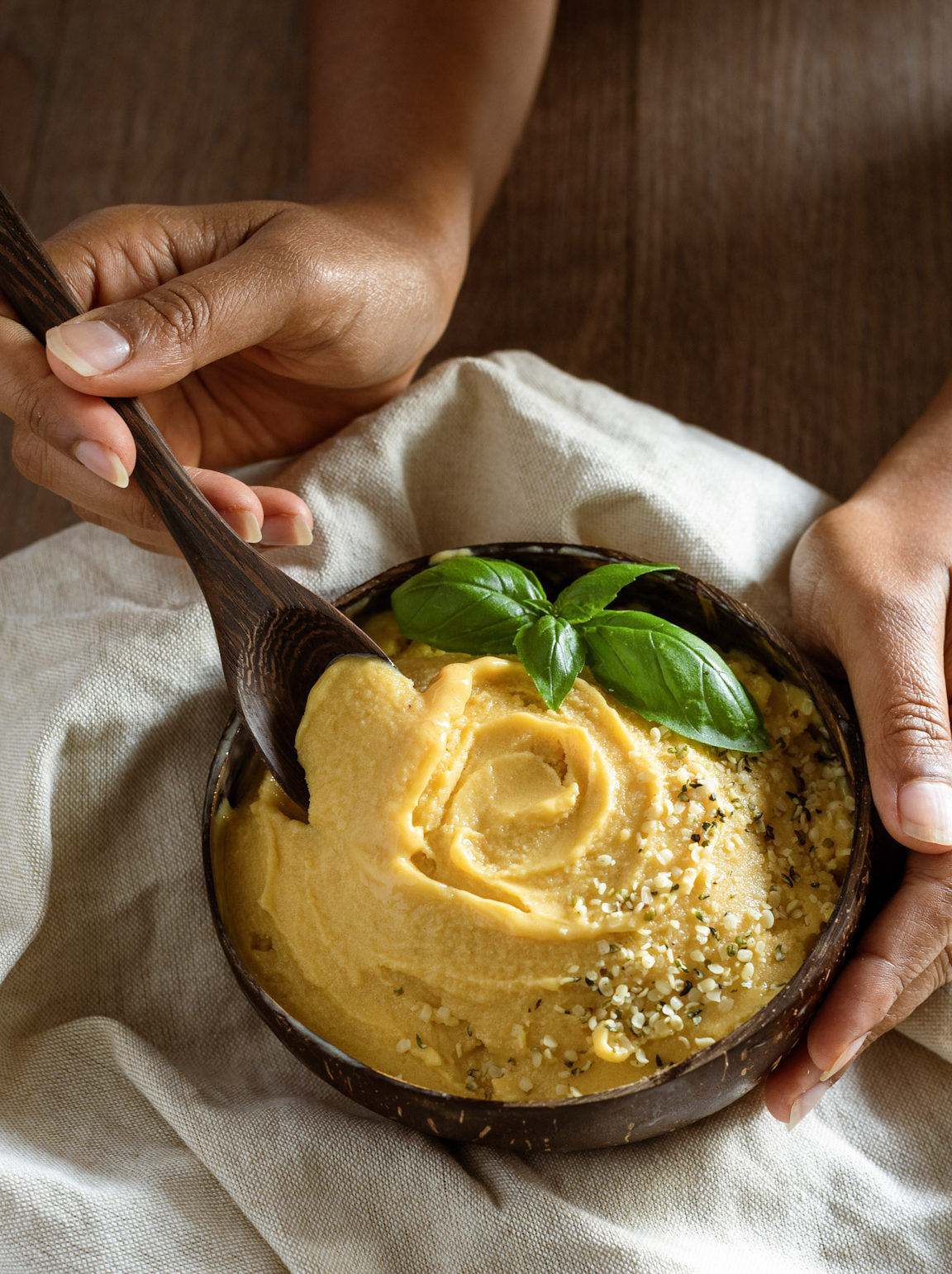 Mango Cardamom nice-cream served on a coconut bowl