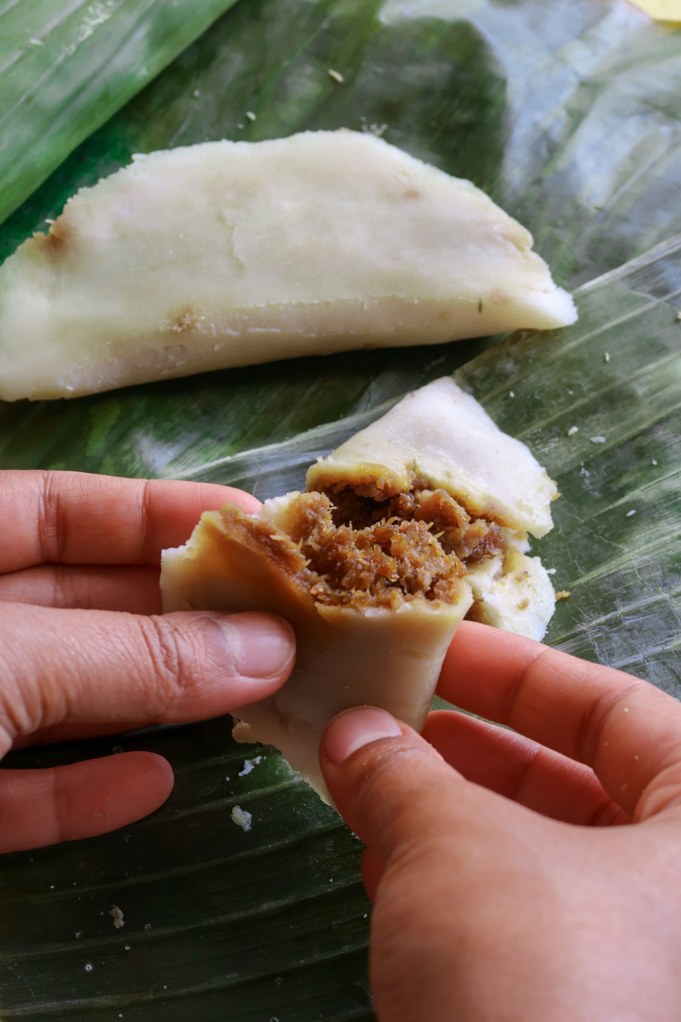 Ela Ada being held in hands ready to be eaten