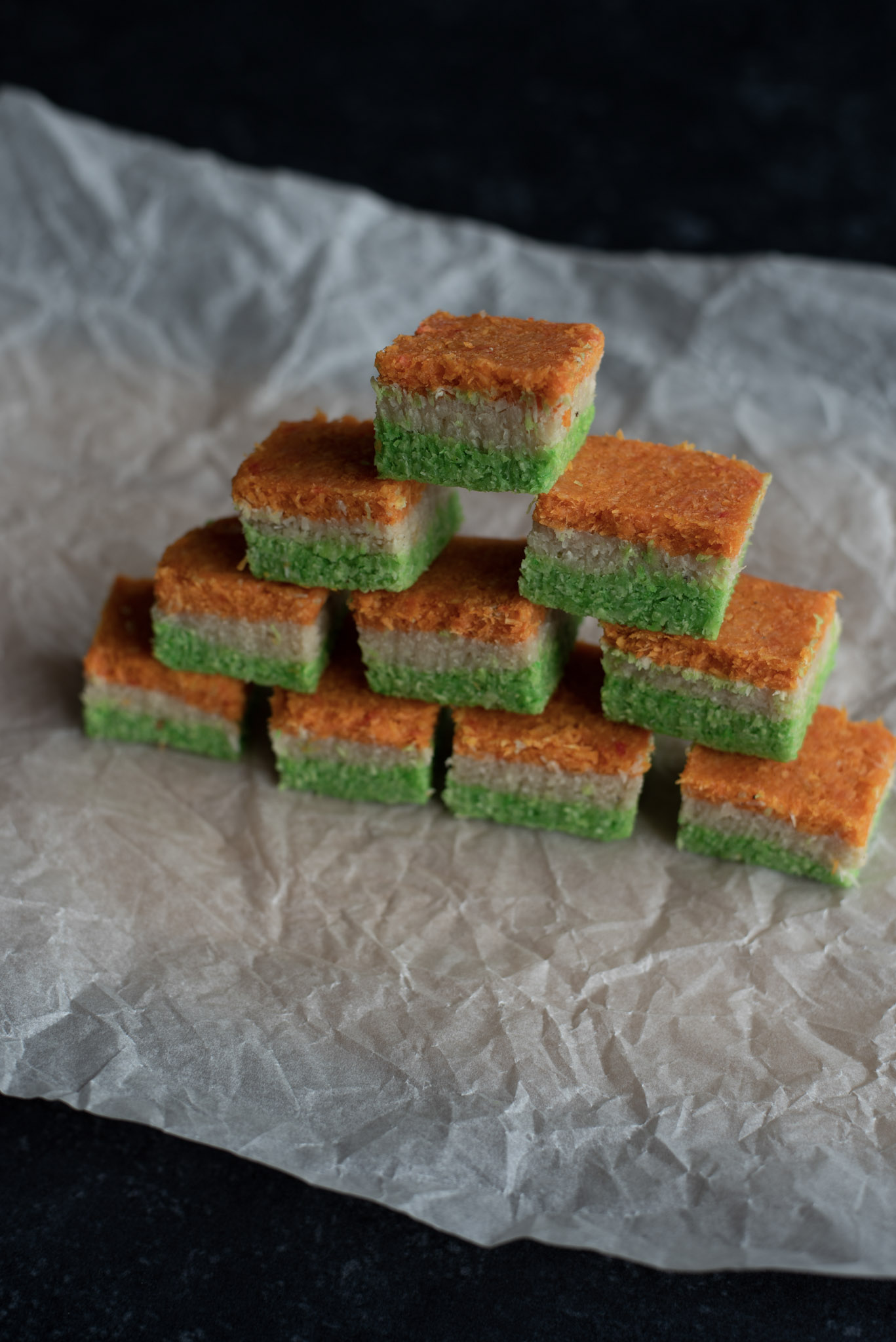 Vegan tricolour barfi stacked up like a tower