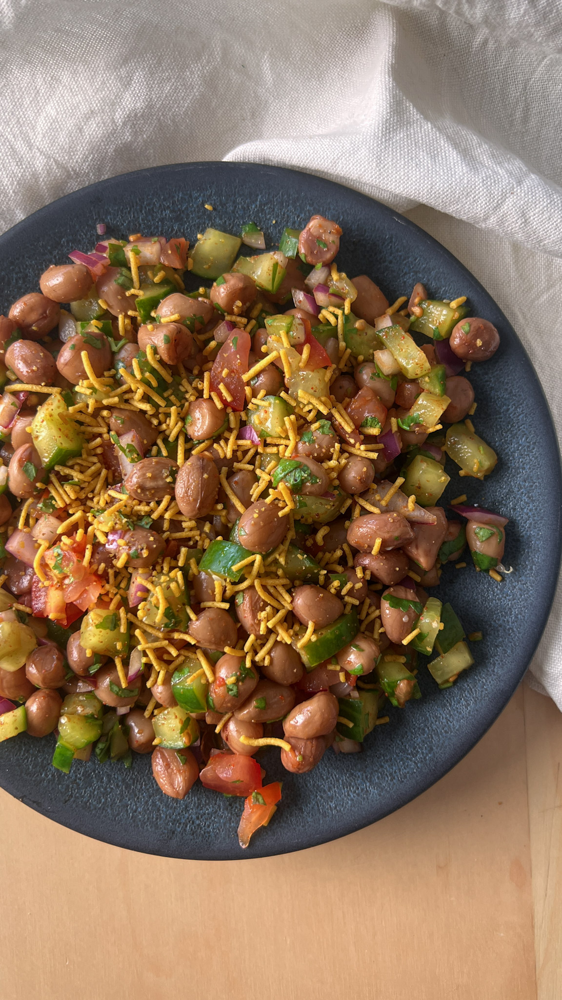Boiled Peanut salad served on a blue plate - Top view