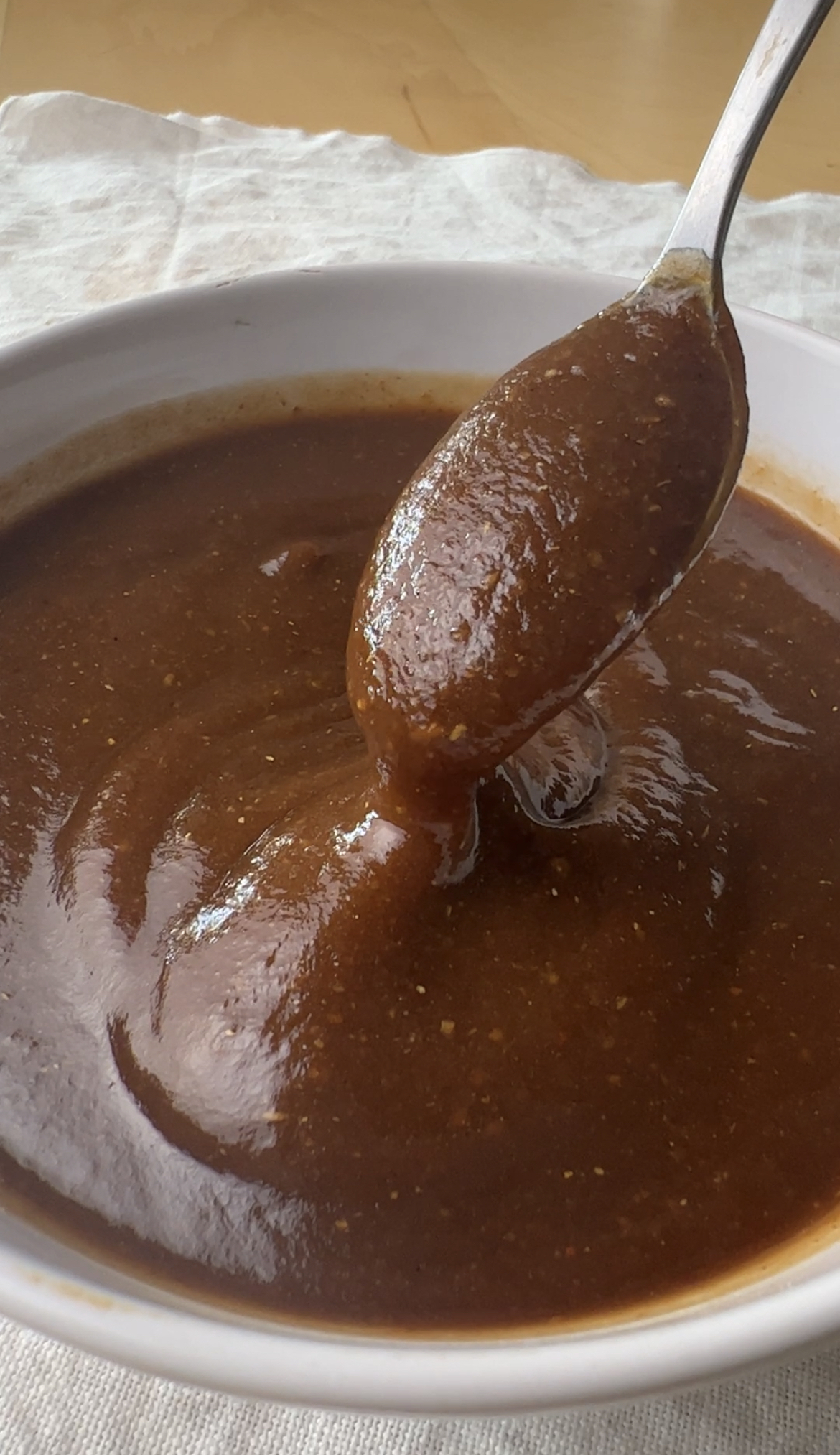 Image of Tamarind Chutney being scooped up in a spoon