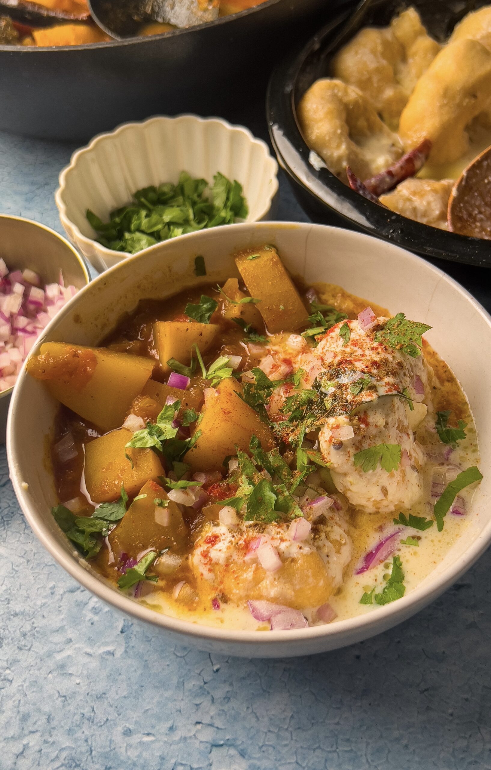 Dahi Bara aloo dum served in a bowl, front angle