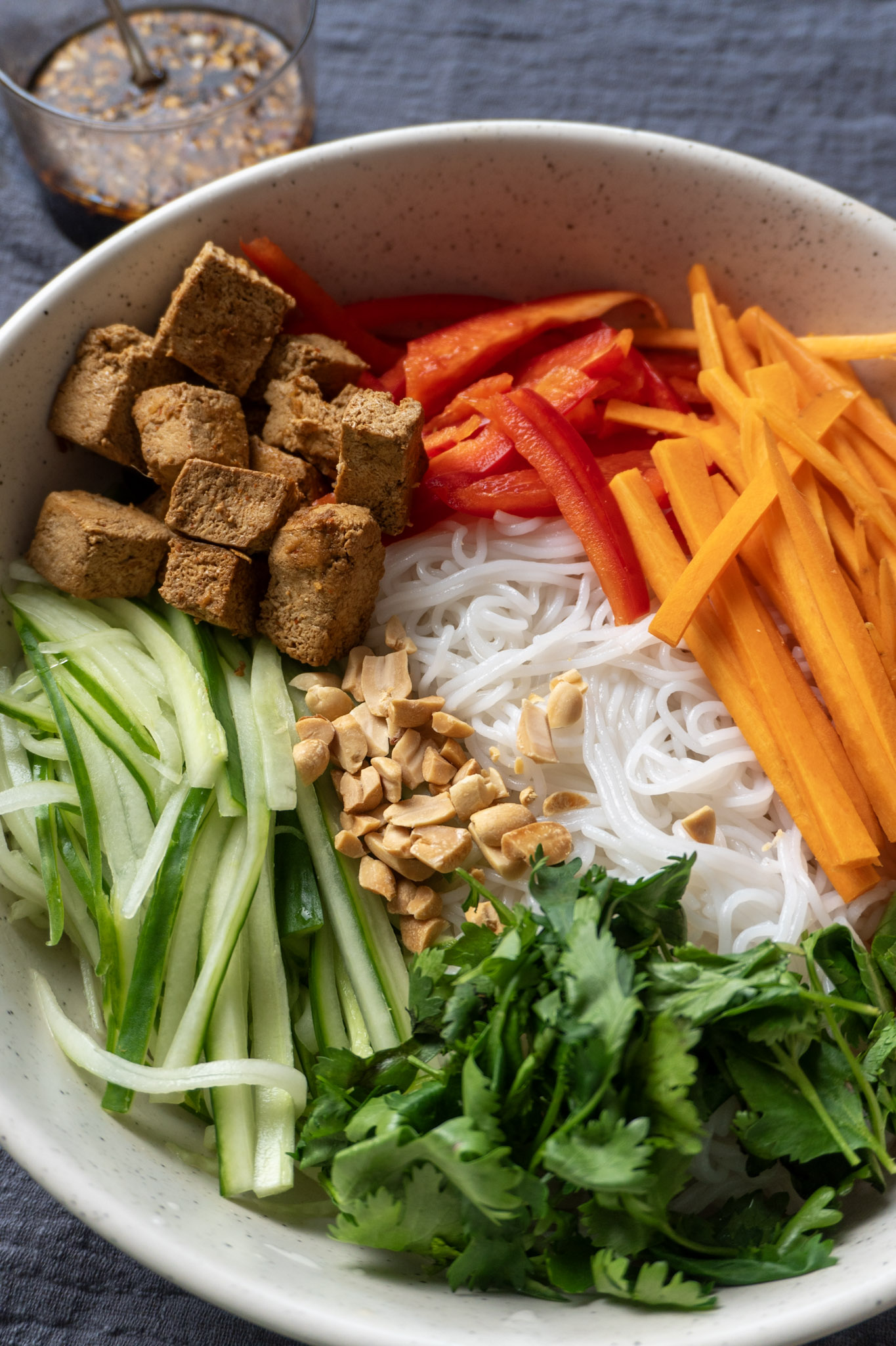 Vietnamese Noodle Salad served in a cowl with the nuac cham sauce on the side