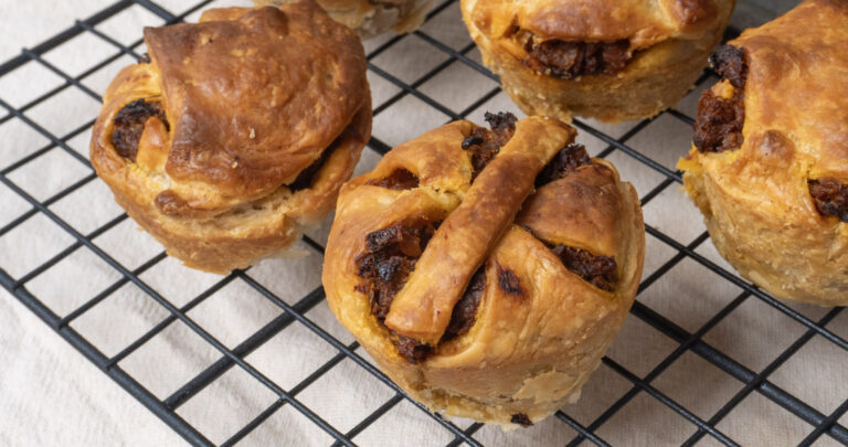 top view of vegan keema meat pies on a wire rack