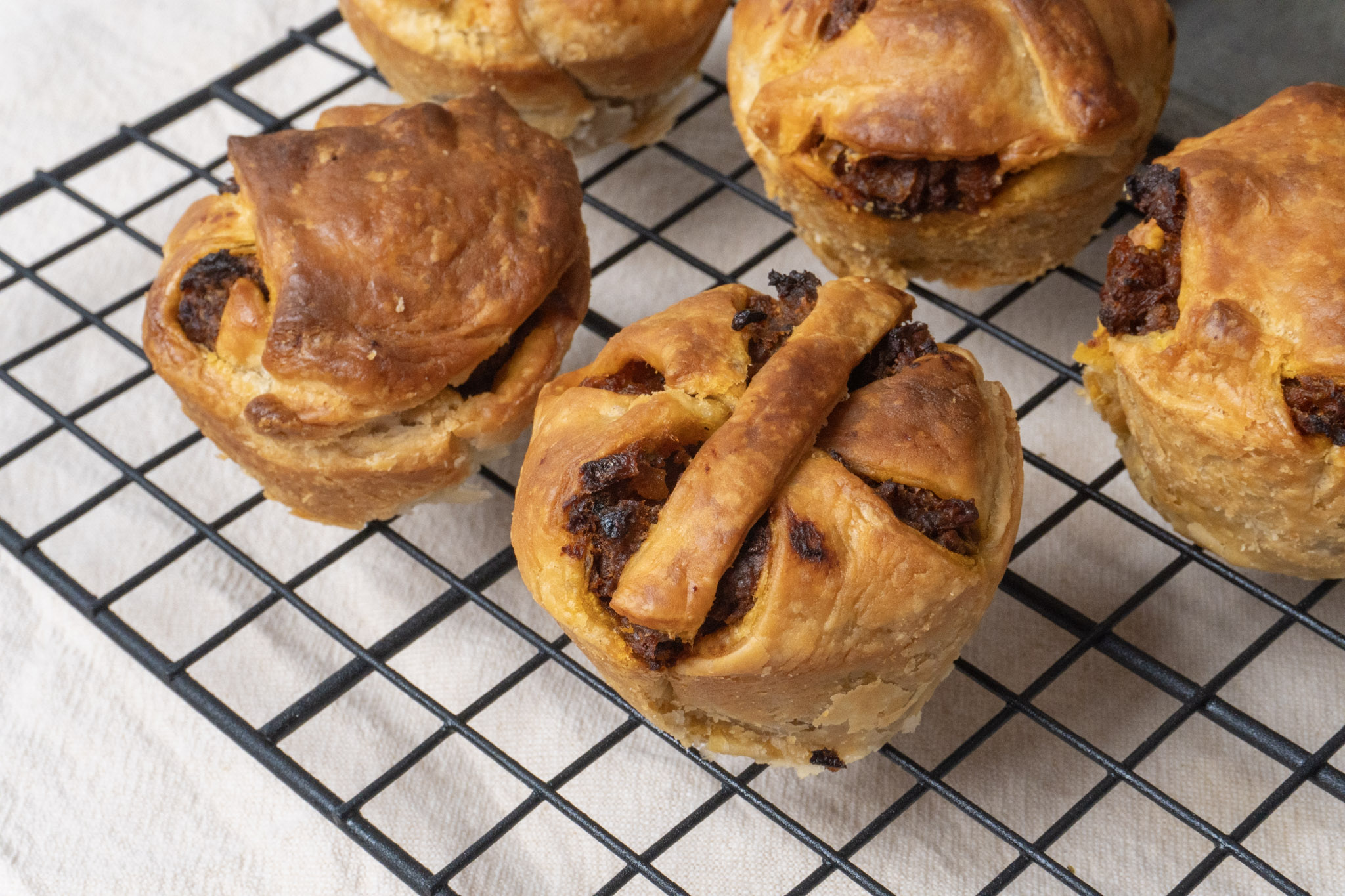 top view of vegan keema meat pies on a wire rack