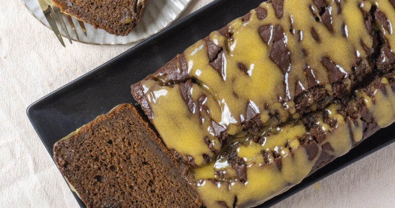 top view of frosted vegan pumpkin loaf