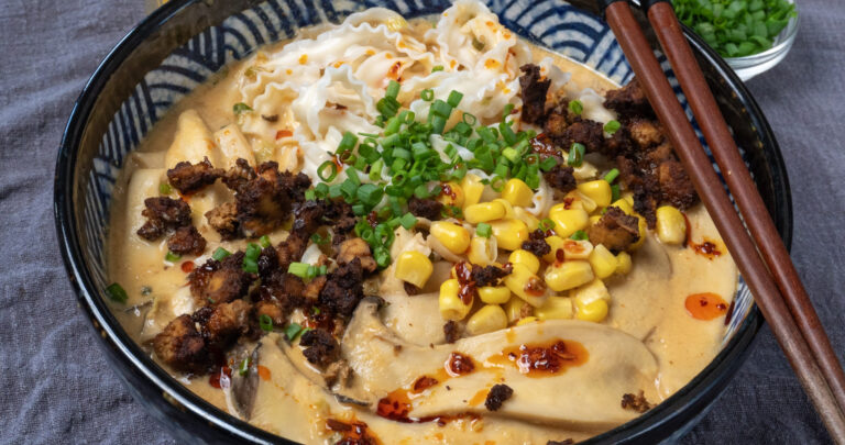 bowl of vegan creamy ramen with chopsticks resting on top