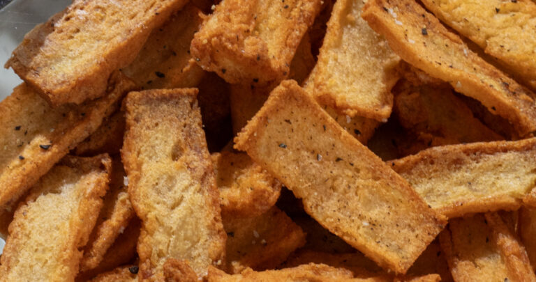 baked lentil chips in a glass bowl, close-up shot
