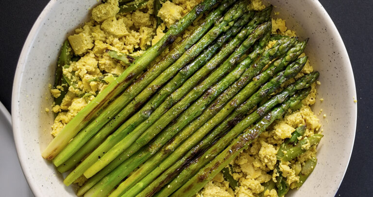 Asparagus Tofu Scramble in a large white bowl. Top shot.