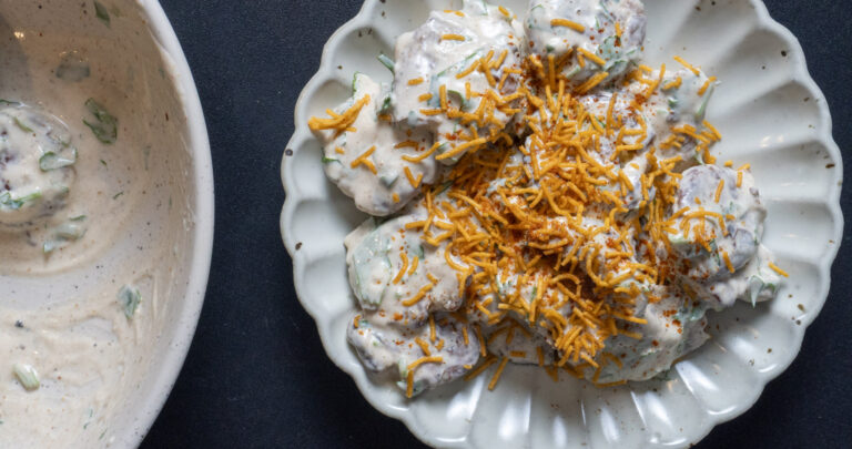 bird's eye view of plated crispy smashed potato chaat salad