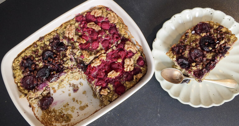 protein baked oats with a slice taken out on a plate, top view
