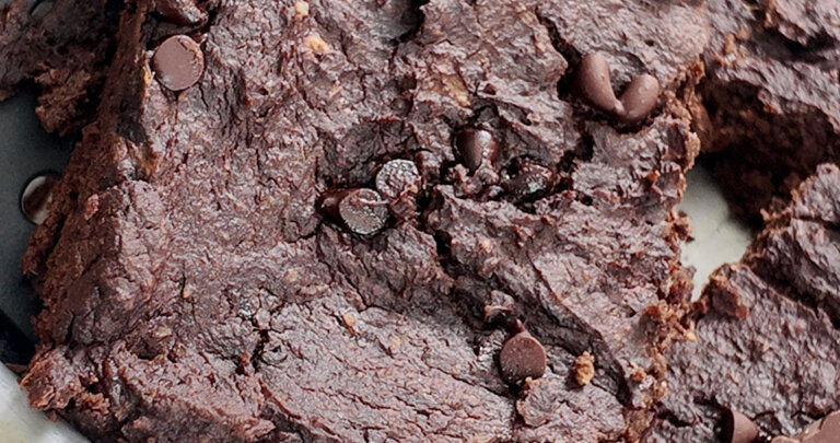high protein sweet potato brownie taken out with a spatula from the baking pan